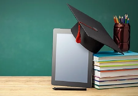 Online education. Distance learning at home. Tablet and stack of