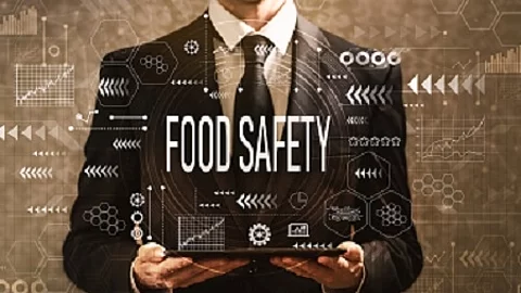 Food safety with businessman holding a tablet computer