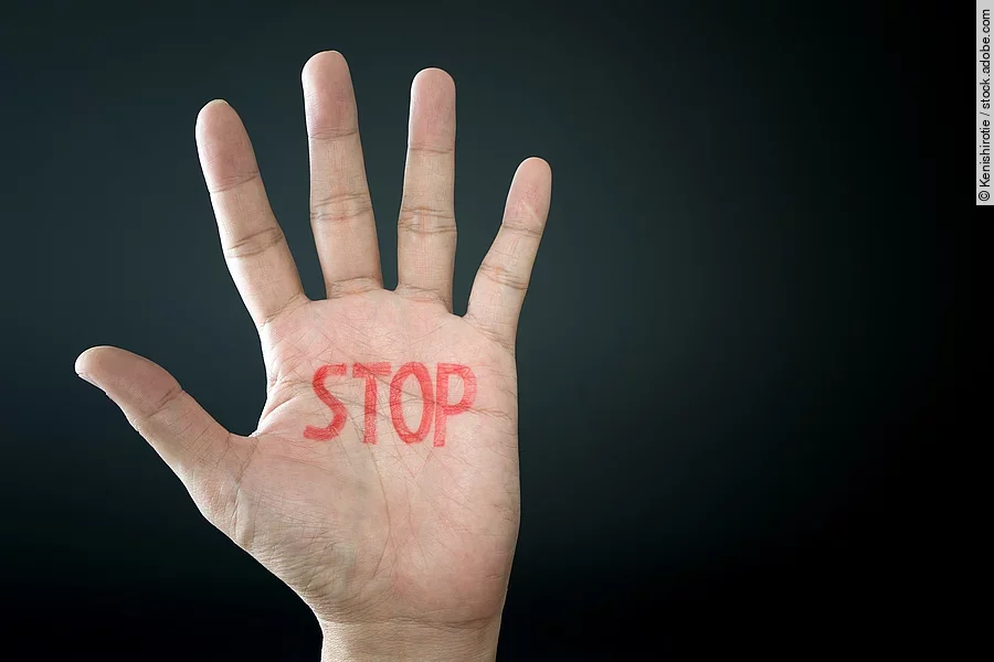 Hand with stop sign