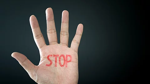 Hand with stop sign