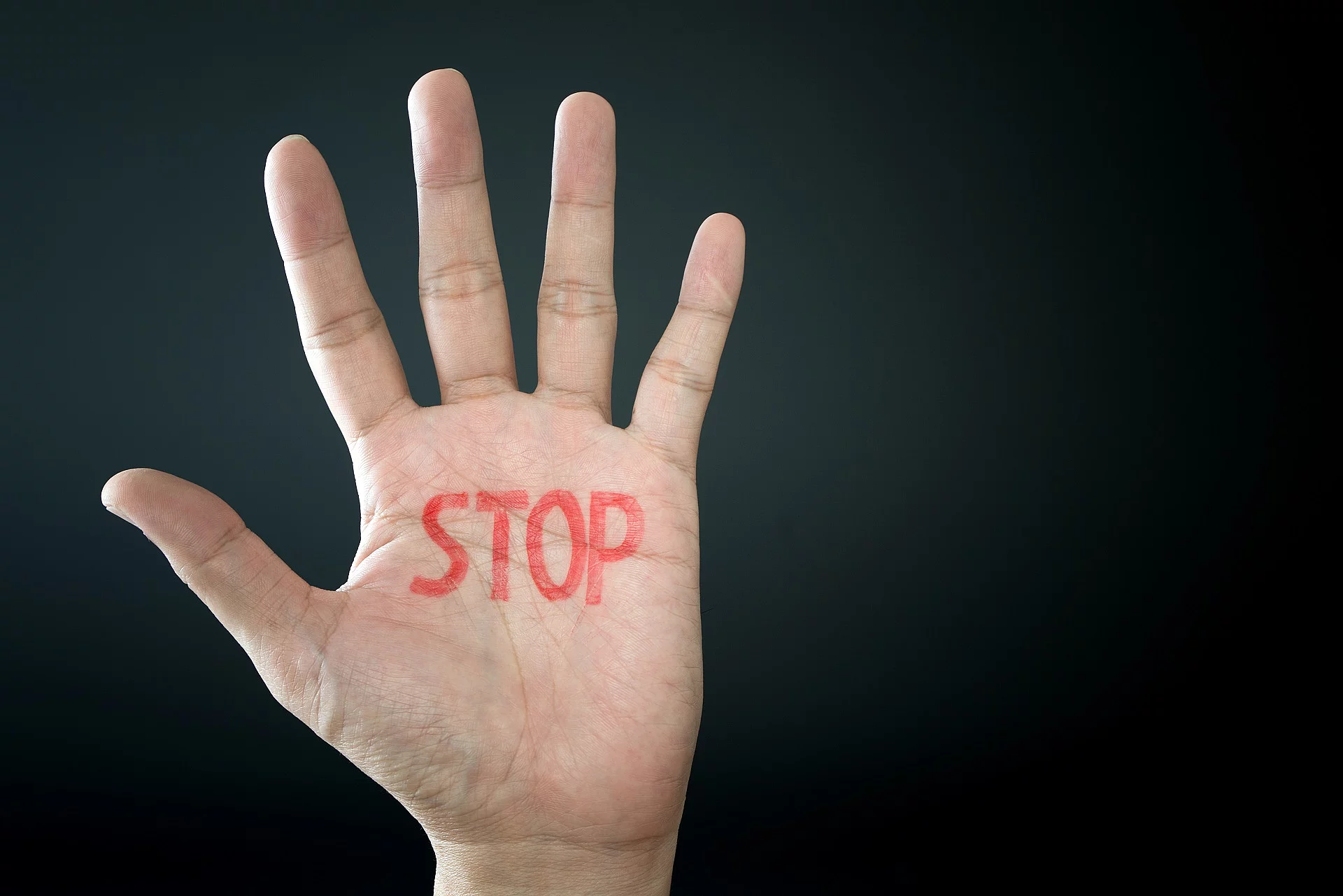 Hand with stop sign