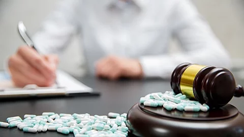 Medicine law concept. Judges gavel with pills