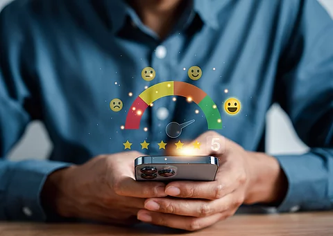 Man giving five star by smartphone, customer satisfaction feedba