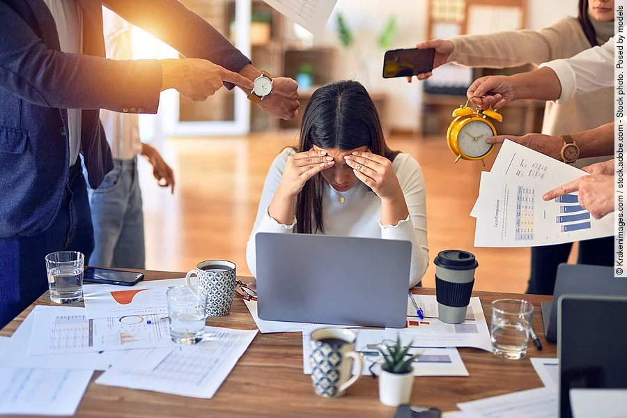 Group of business workers working together. Partners stressing o