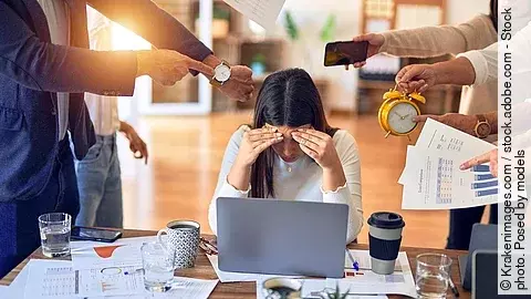 Group of business workers working together. Partners stressing o