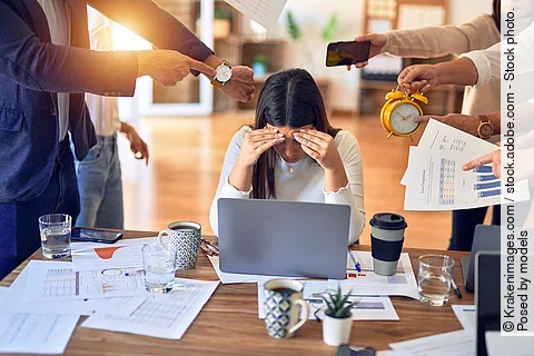 Group of business workers working together. Partners stressing o