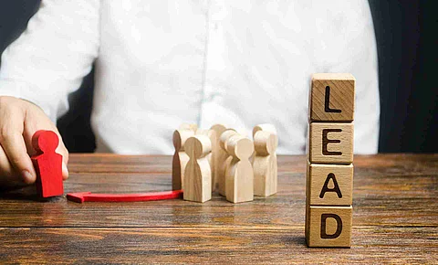 A businessman appoints a group of people a new leader. Appointme