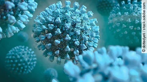 Einige Viren in blauer Farbe sind im Bild erkennbar.