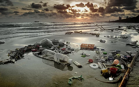 Dirty beach environment from plastic garbage.