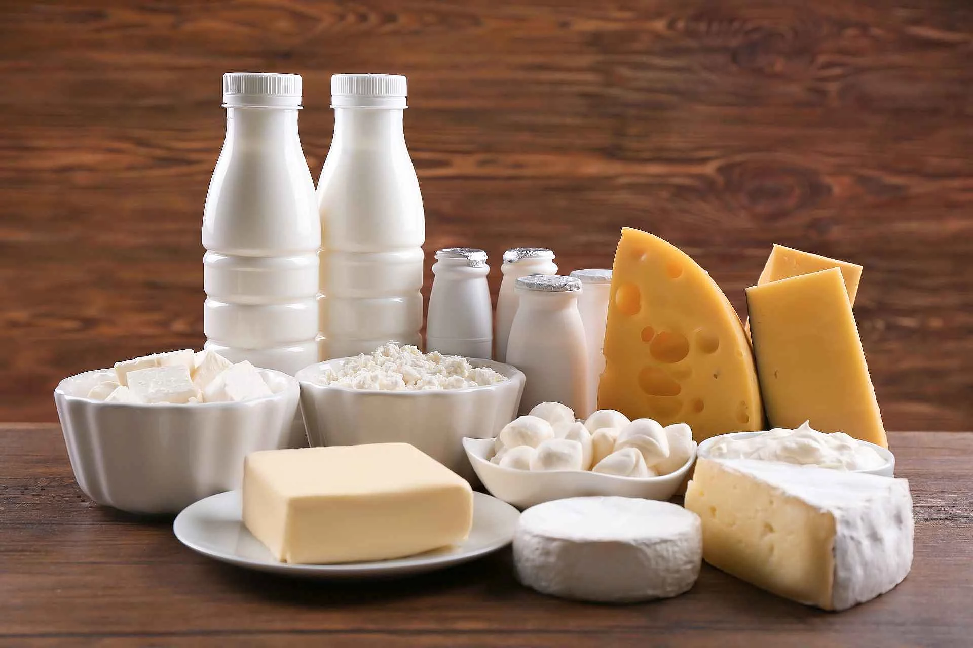 Different dairy products on wooden table