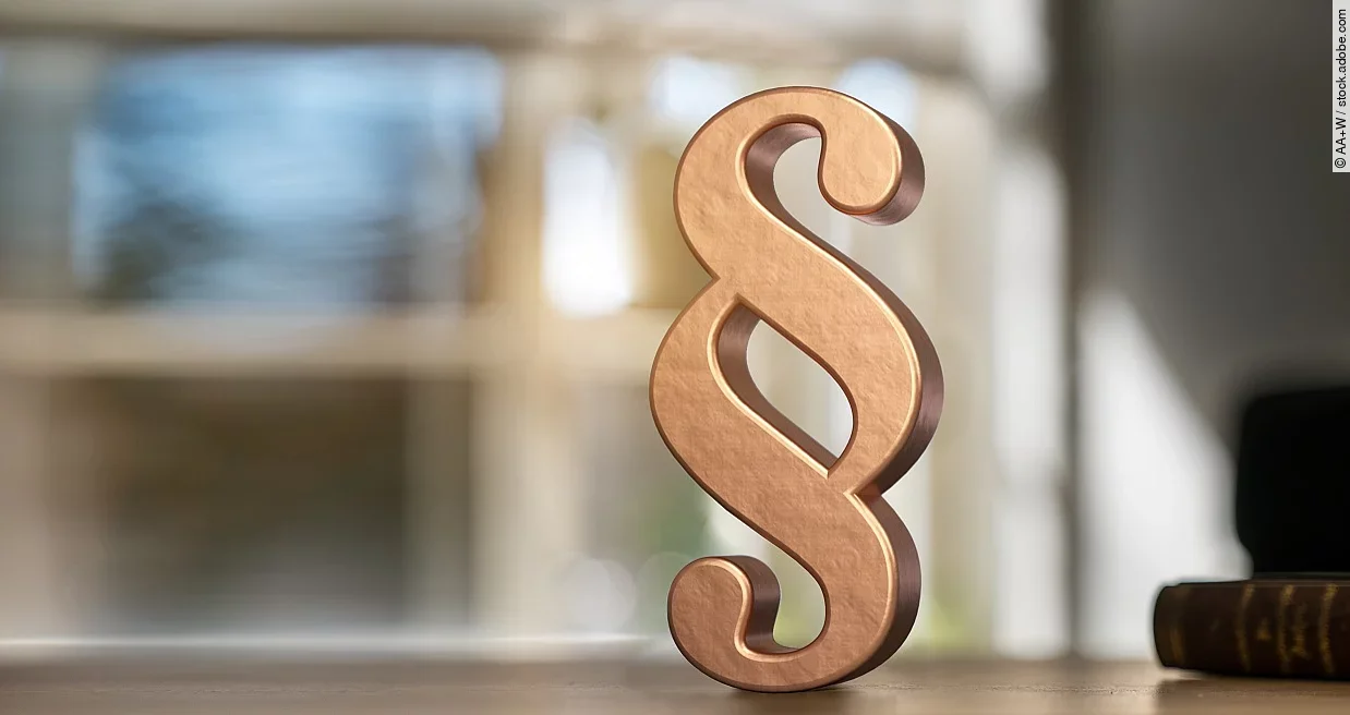 Ein Paragraphensymbol in Gold.