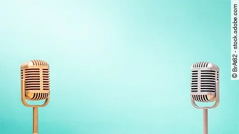 Golden and silver retro microphones on table front gradient mint green background. Vintage old style filtered photo