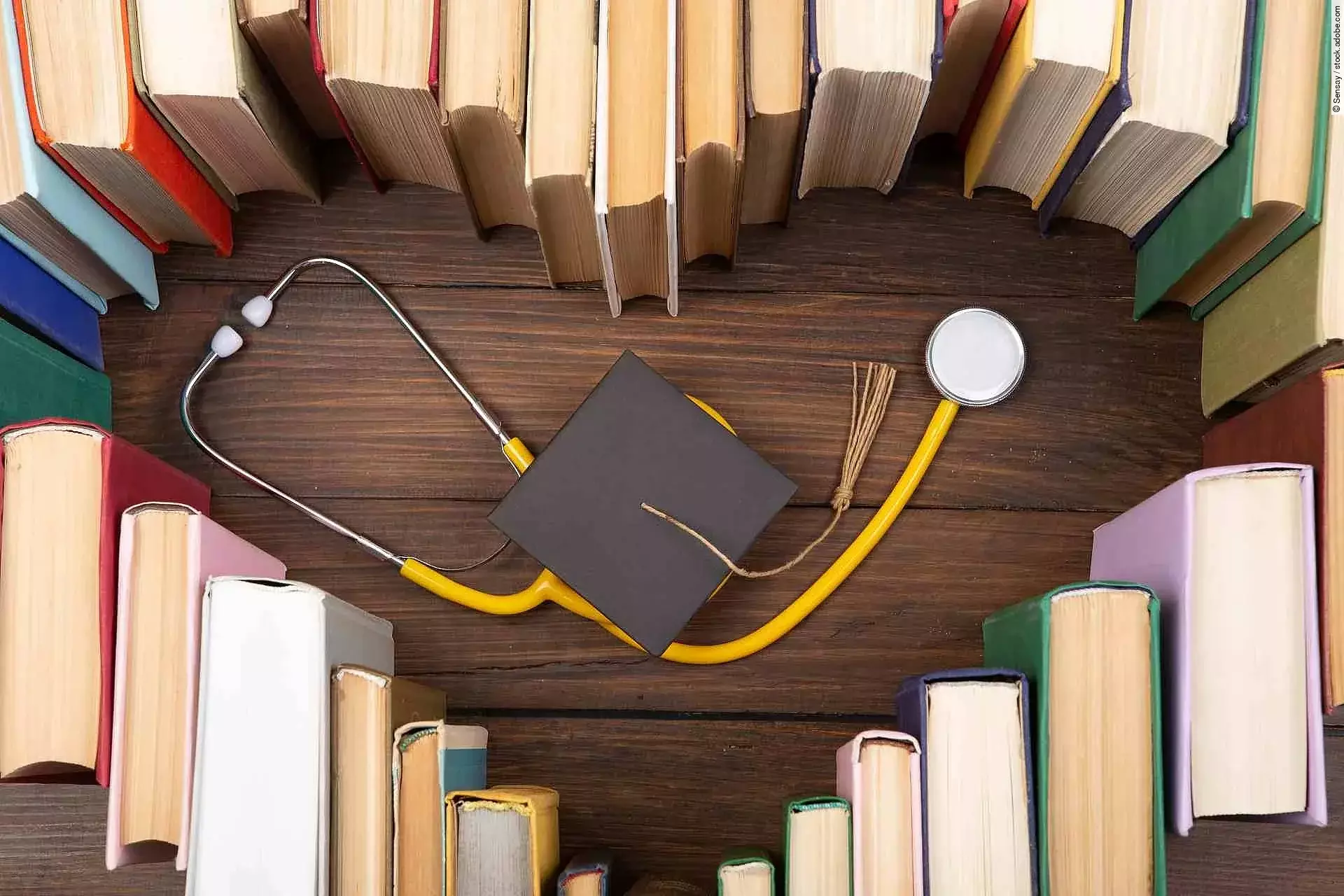 Medical degree education concept - stack of books in heart shape