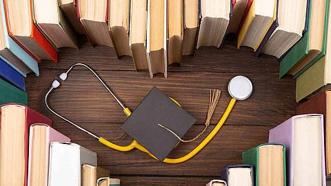 Medical degree education concept - stack of books in heart shape