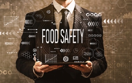 Food safety with businessman holding a tablet computer
